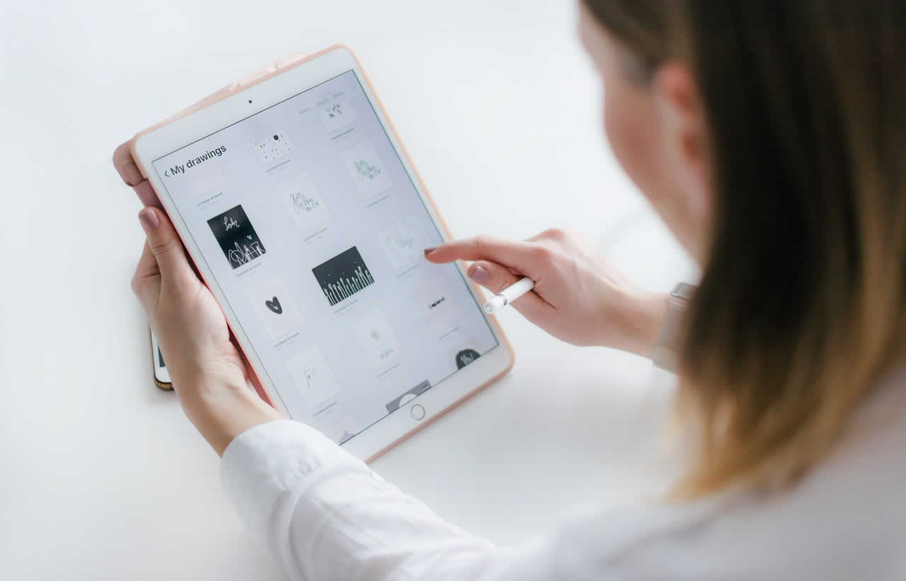 Person exploring a digital design on a tablet
